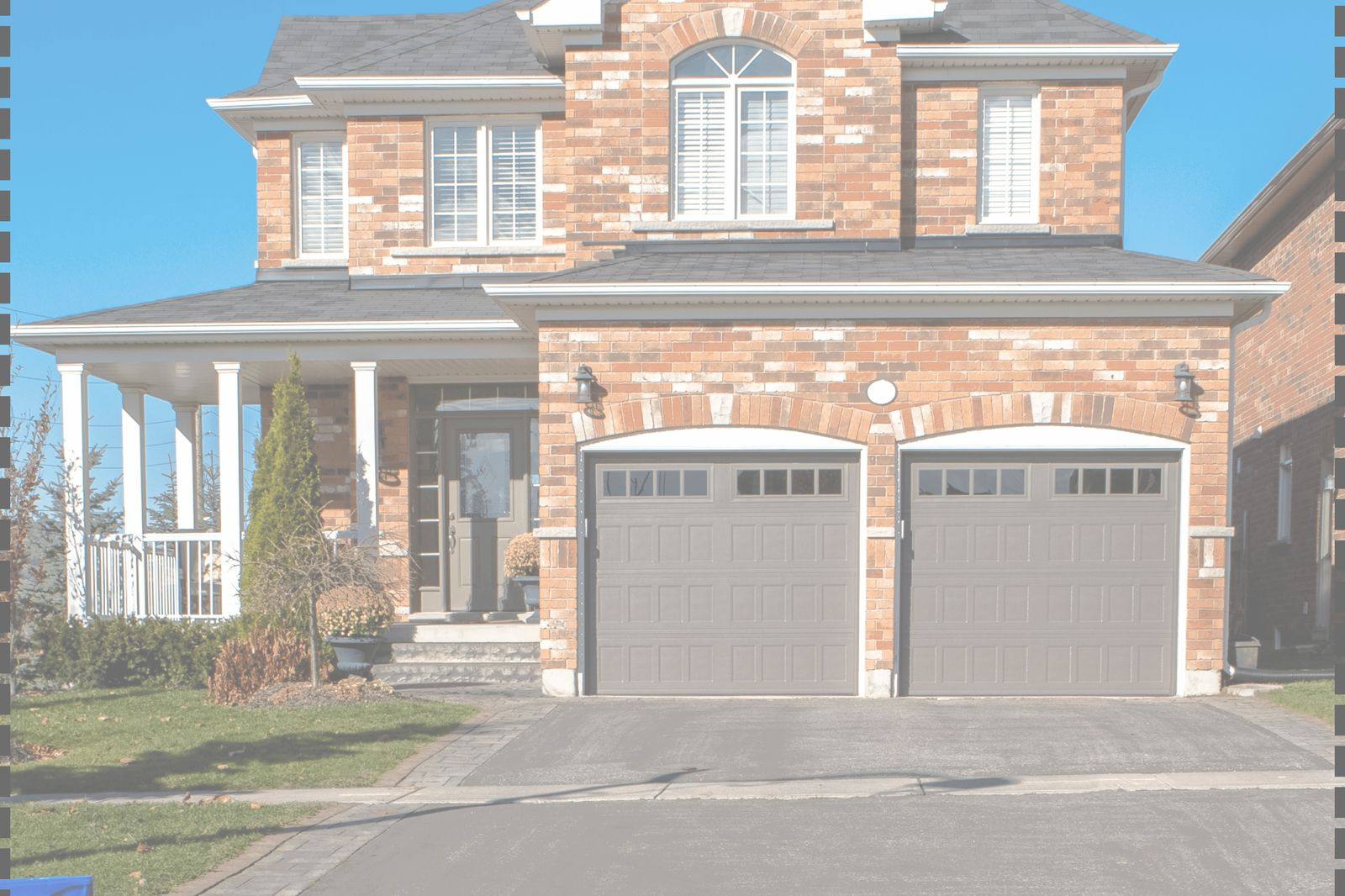 Brick house with double garage doors